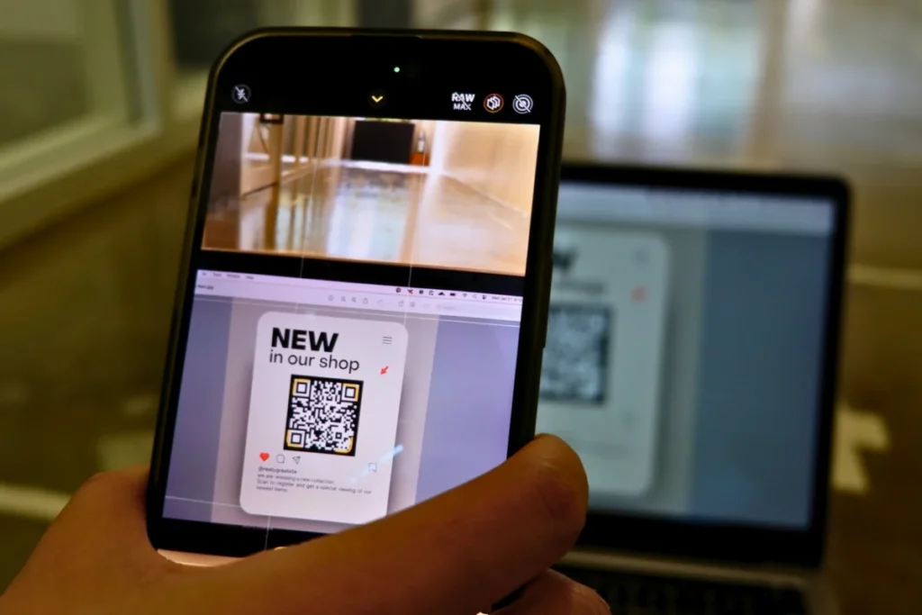 Smartphone camera scanning a printed QR code, the quickest way for a customer to open a review form
